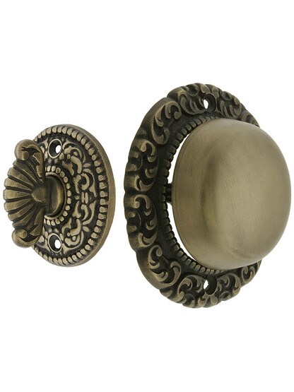 Small Scroll Design Twist Door Bell in Antique Brass.